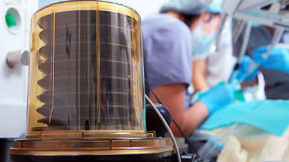 Surgery under anesthesia. Anesthesia machine. Work of surgical teams visible in background. Clinical equipment and surgical surgery. 