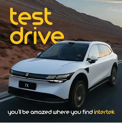 A modern SUV driving through a mountainous road