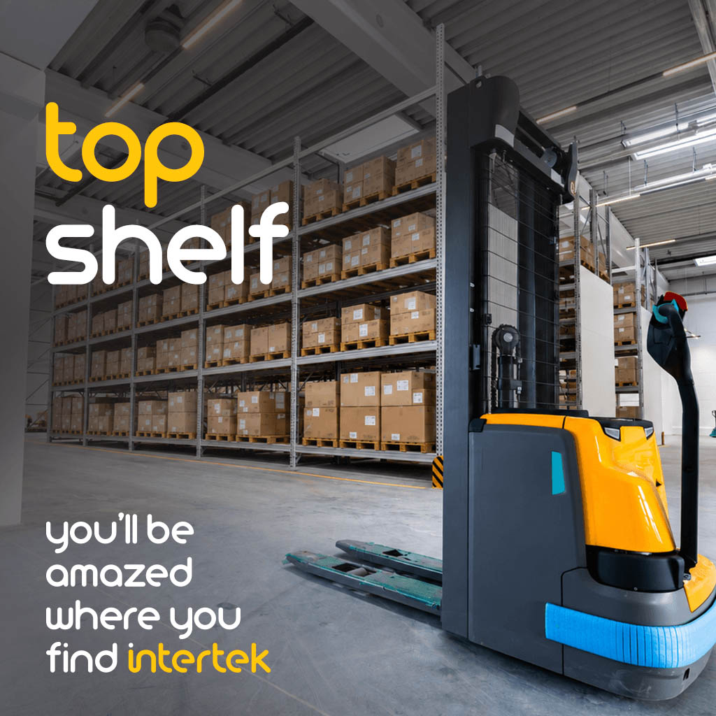 A forklift in a warehouse aisle